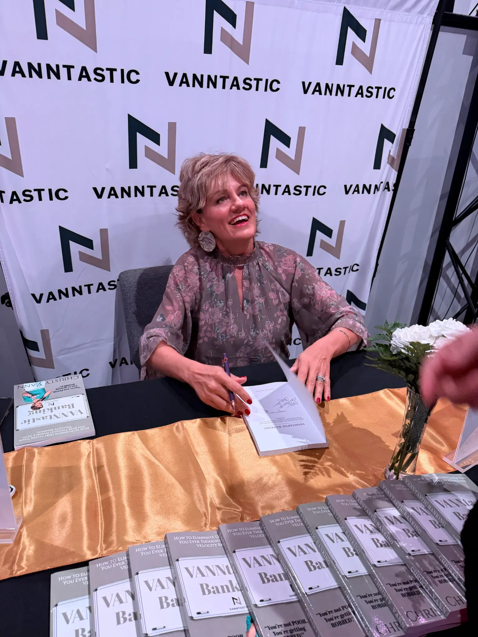 Christy signing copies of her book