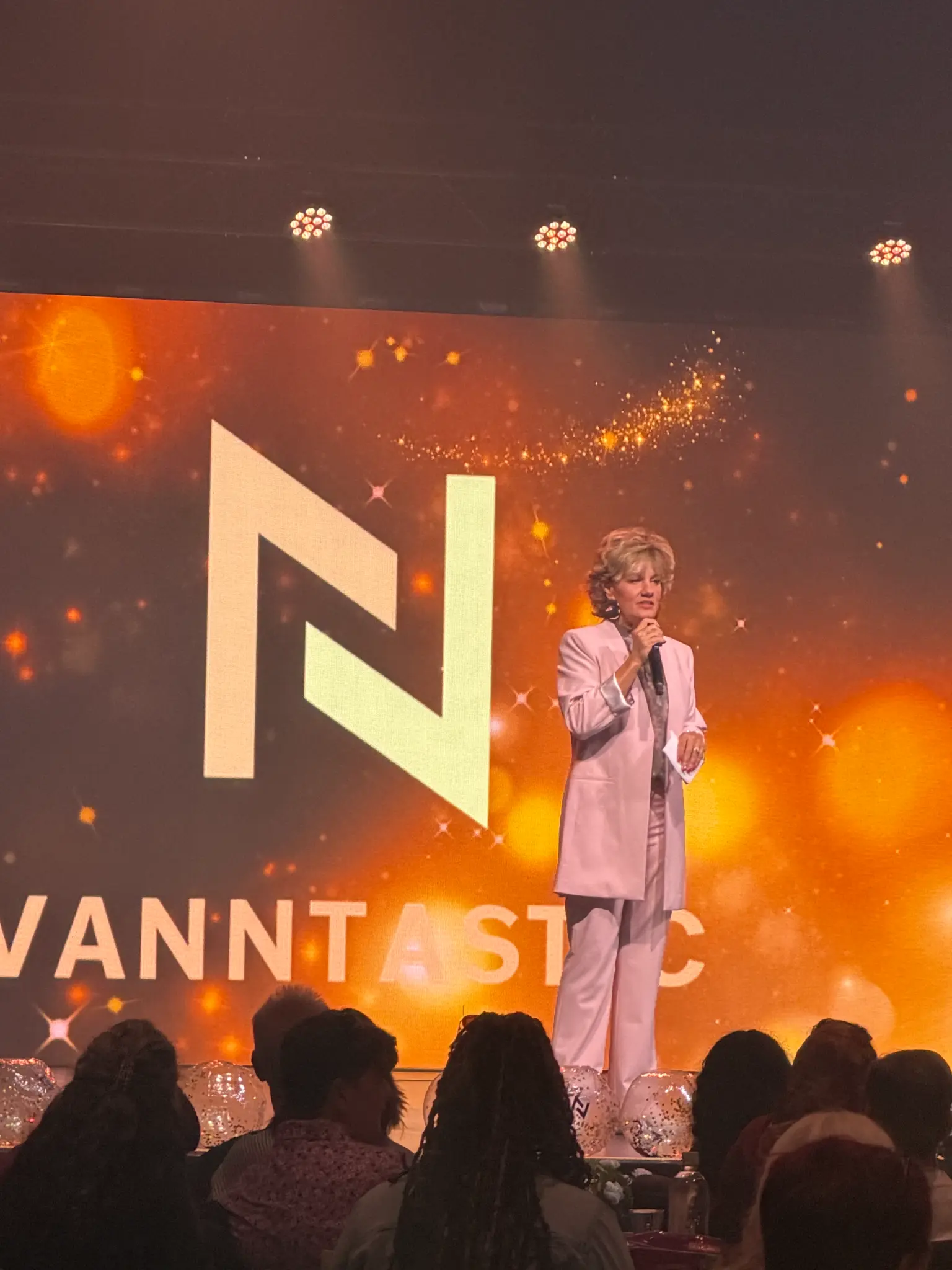 Christy Vann speaking on stage
